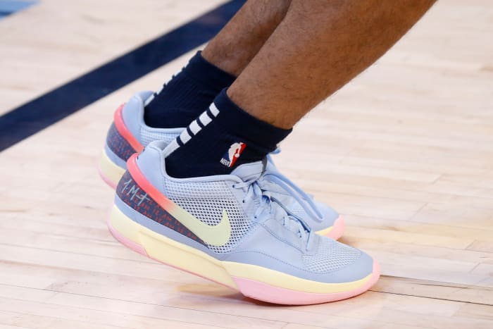 View of Ja Morant's blue, yellow, and pink Nike shoes.